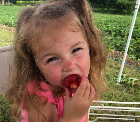 Girl Eating Strawberry