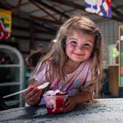 Girls Enjoying Strawberry Sundaes